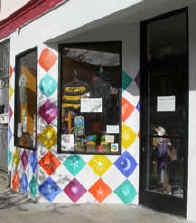 Brightly-painted resale shop stands out in the crowd